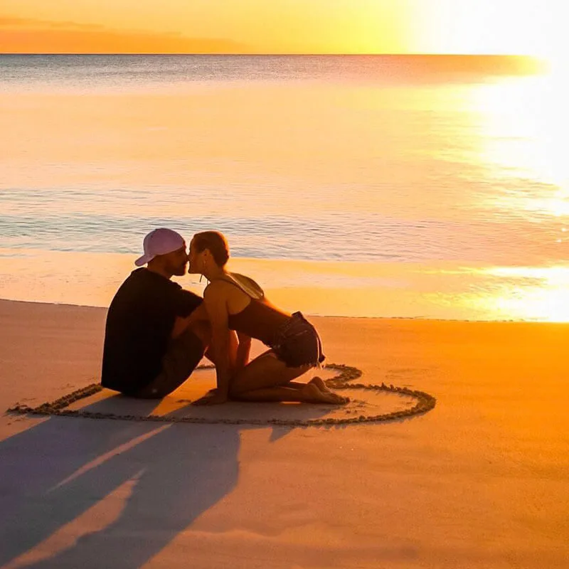 Couple on beach during sunset